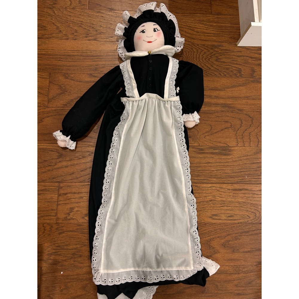 Folk art doll vacuum cleaner cover designed to look like a colonial maid.
